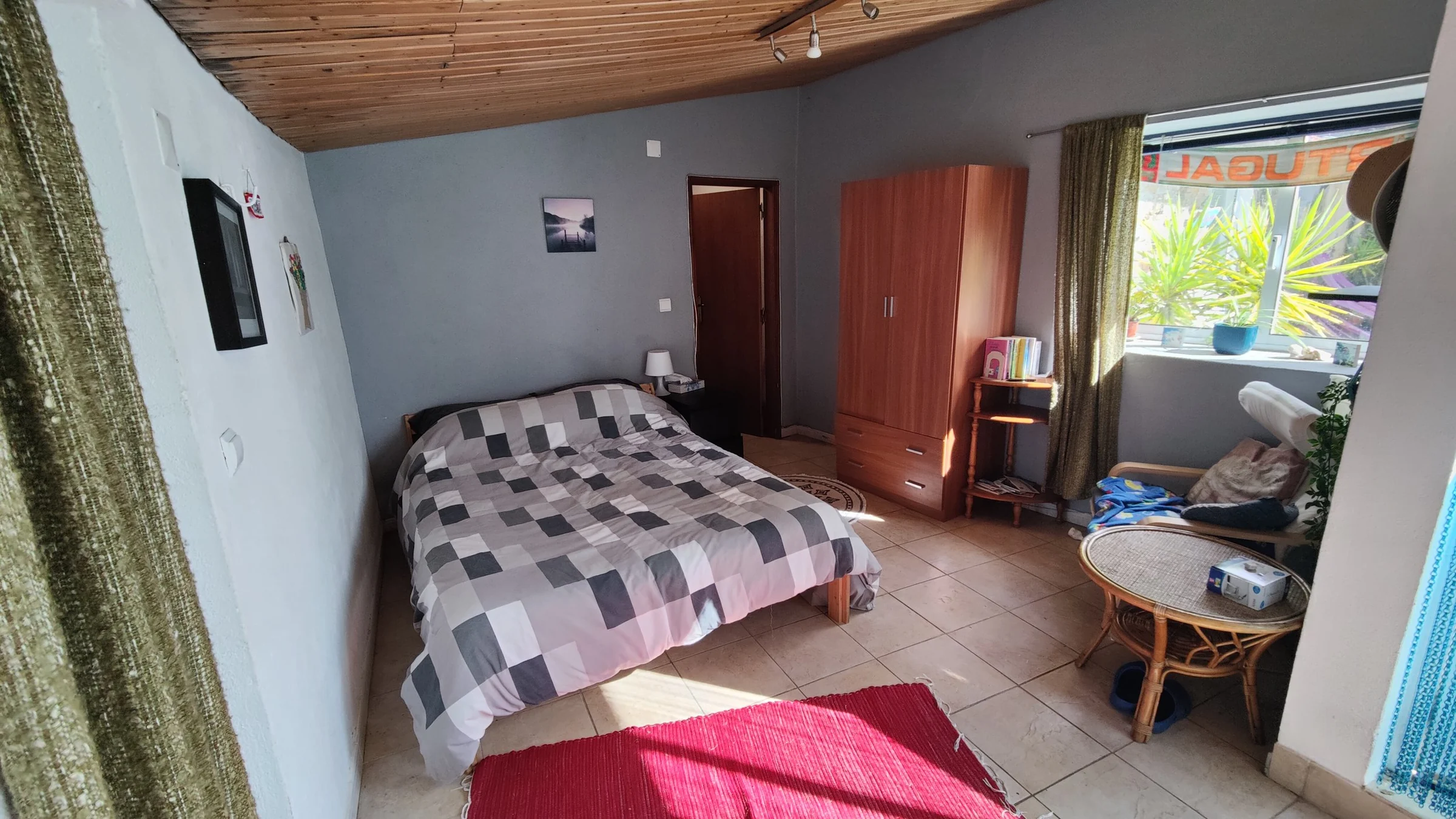 The double bed and seating space inside the guest annex