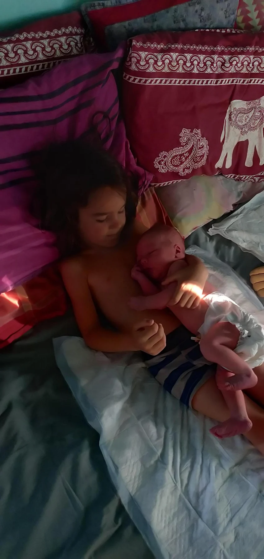 Ros holding newborn Wilfy moments after his home birth in Portugal