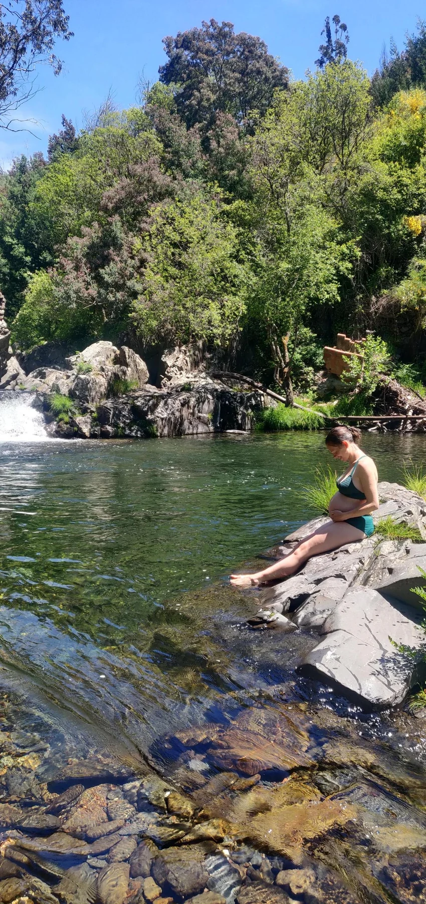 Ros relaxing beside a river while pregnant with Wilfy