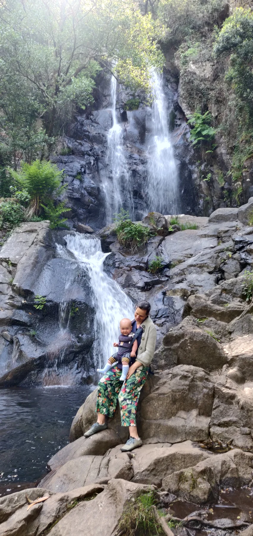 Tom, Ros, Lawrie and Wilfy exploring beside a waterfall during family life in Portugal