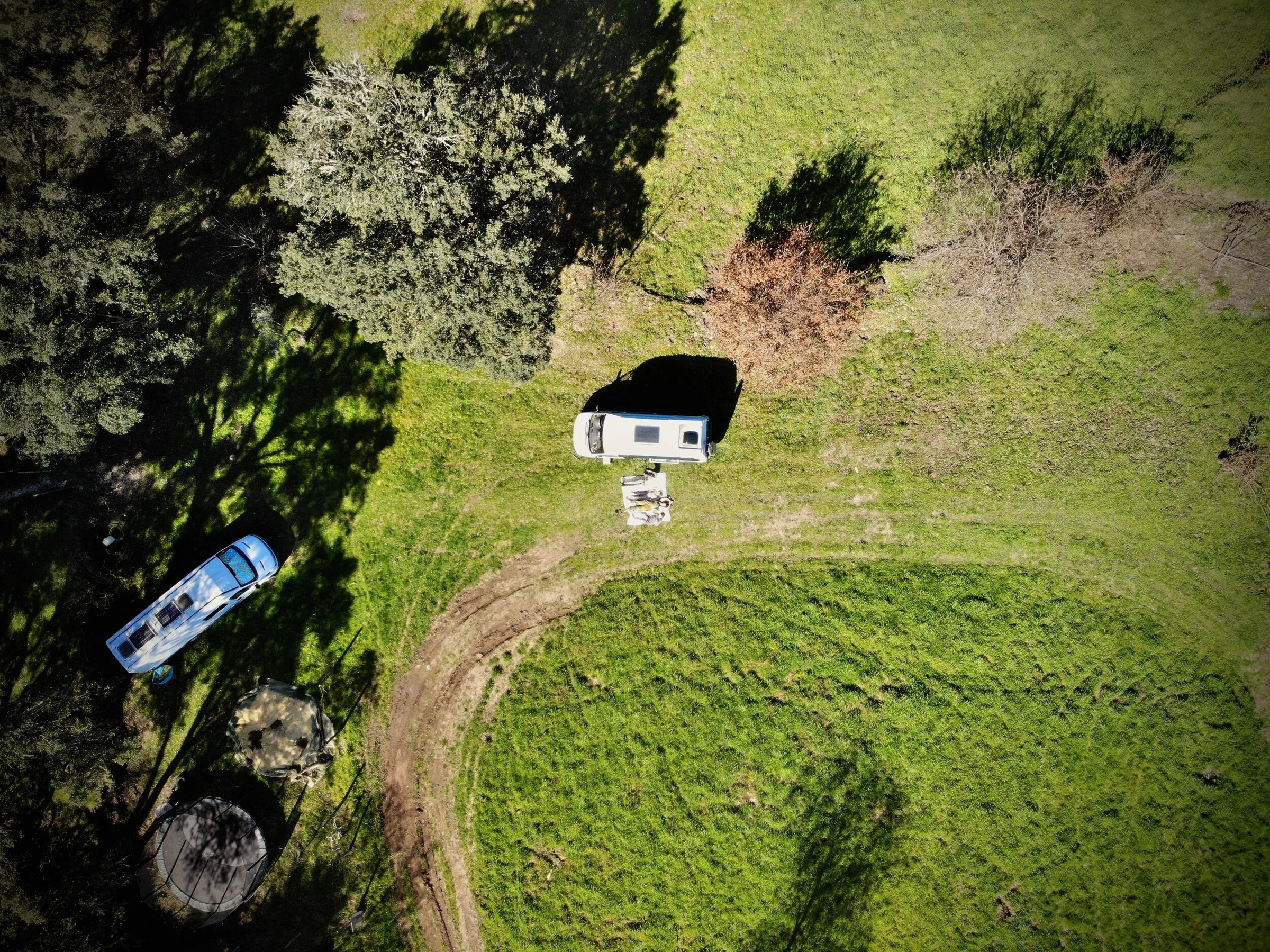 Campervans and motorhomes camping across the family's rural land in Central Portugal