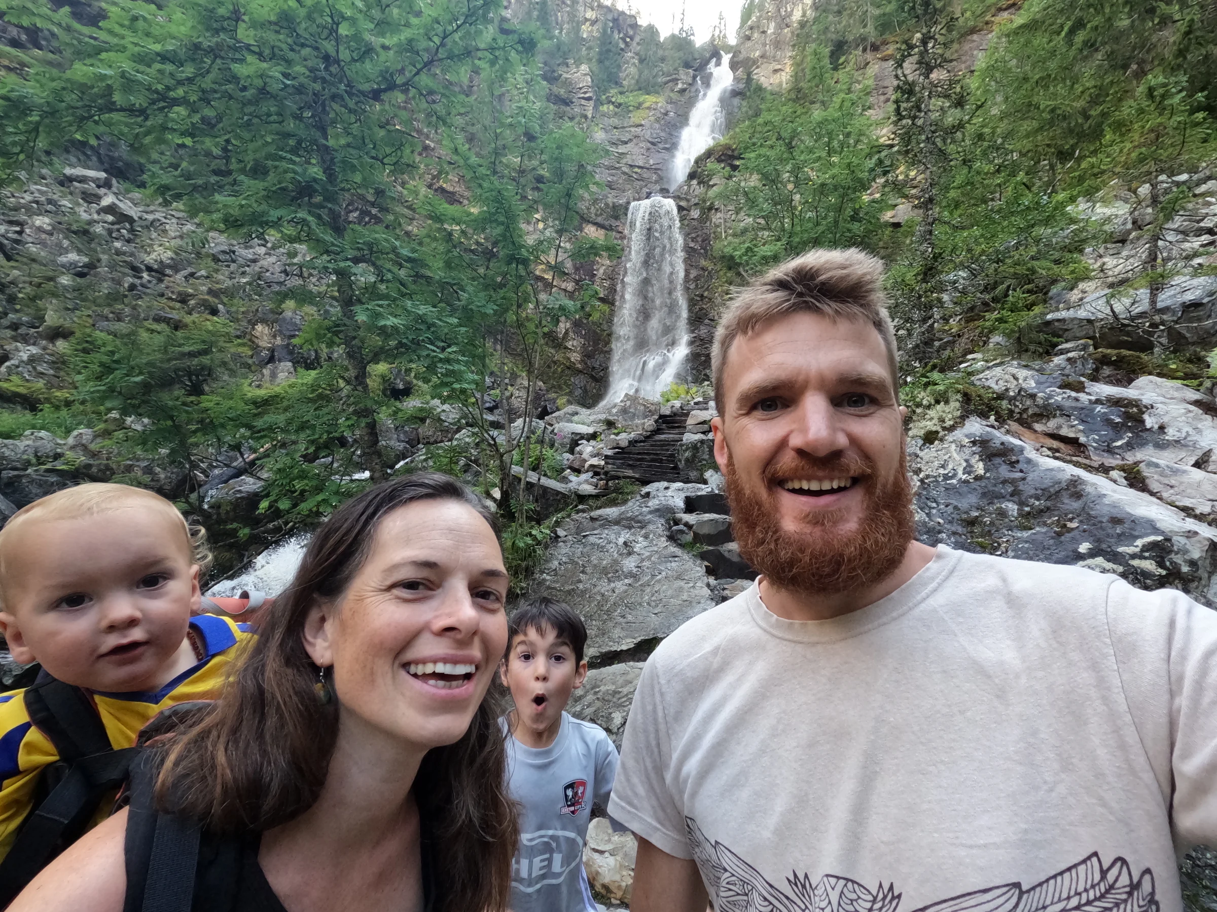 Tom, Ros, Lawrie and Wilfy beside a waterfall on their Scandinavian road trip