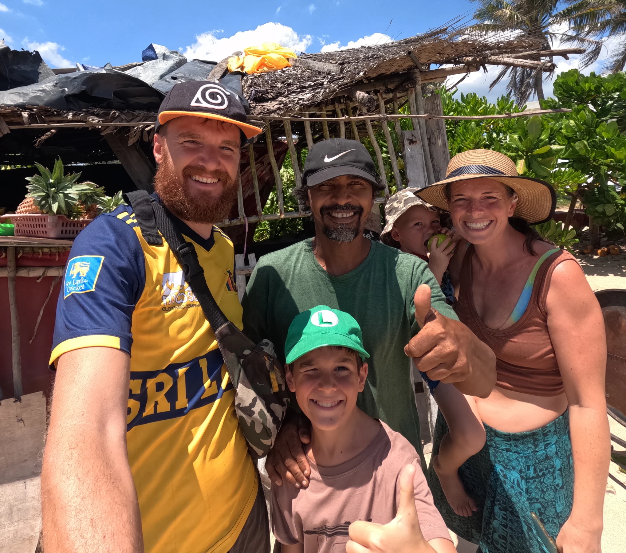 Tom, Ros, Lawrie and Wilfy with Baba beside his beach shack in Sri Lanka