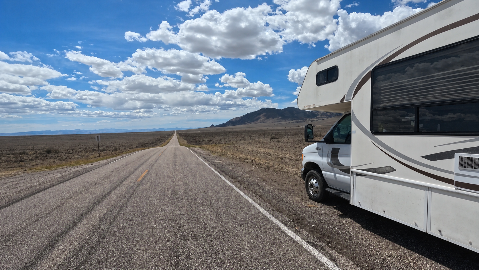 Harvey the RV parked beside an open road during the family's USA road trip