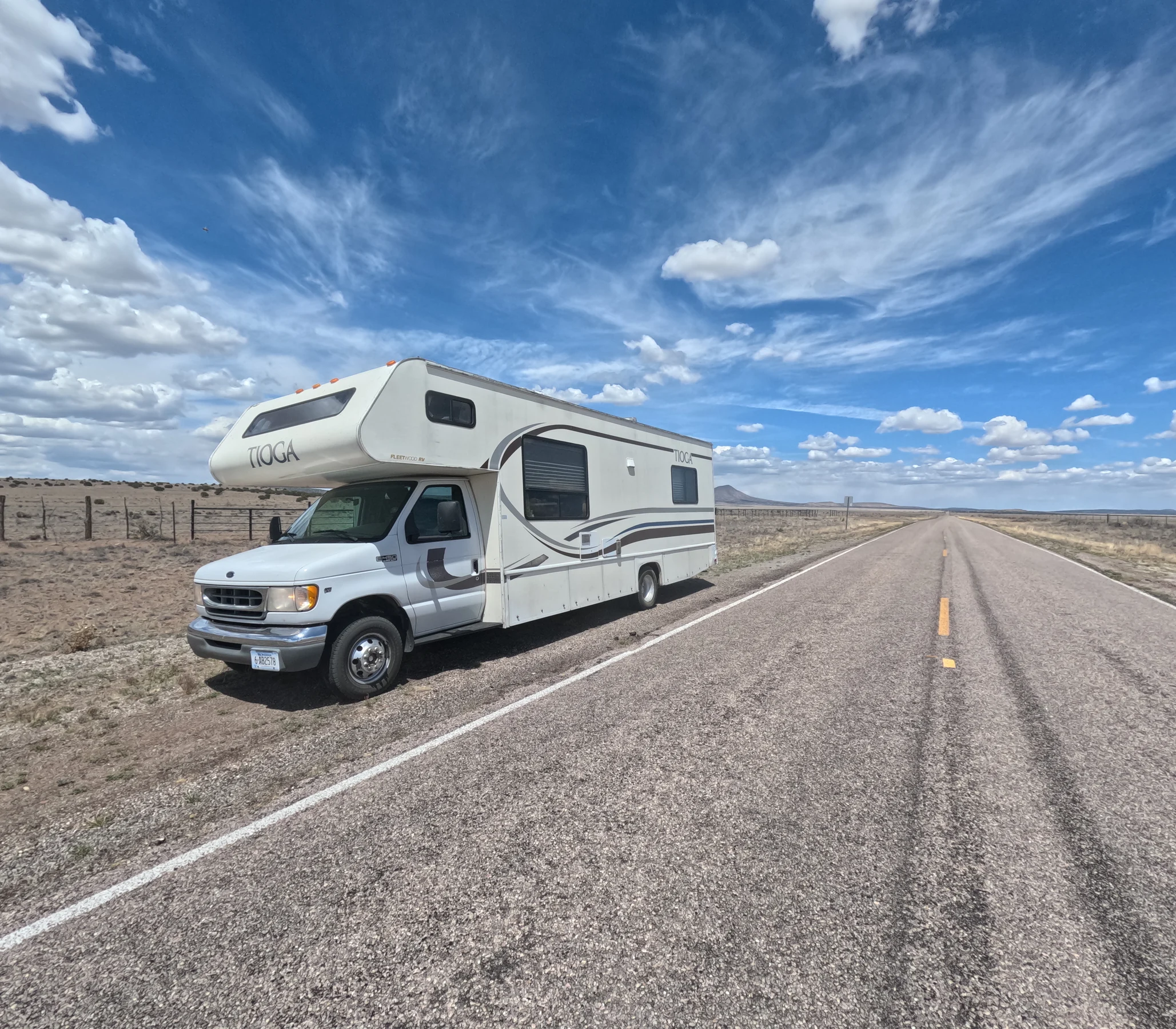 Harvey the RV parked beside an open road during the family's North American road trip